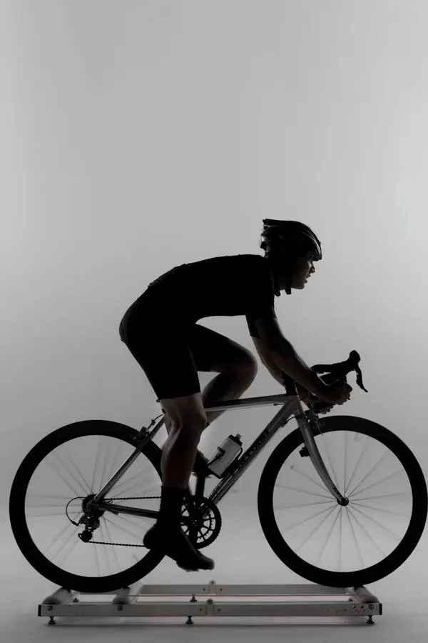 Cyclist on rollers during bike fit session